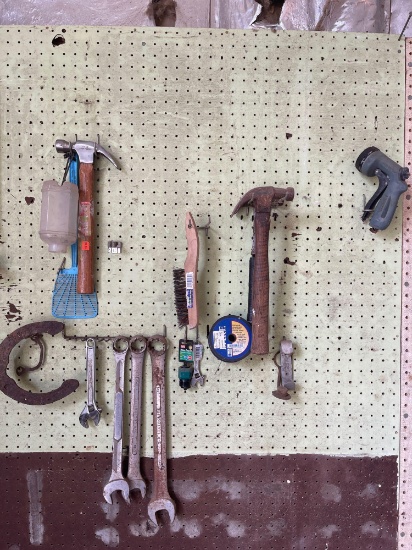Three hammers, steel brush, wrenches and crescent wrenches, hacksaw, staple puller, electric fence