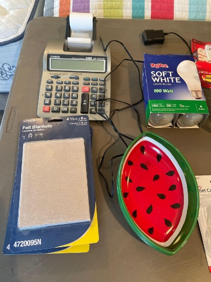 Casio calculator, lightbulbs, stapler, envelopes, pens and pencils, wooden and plastic folding TV