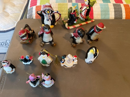Large assortment of penguin figurines.