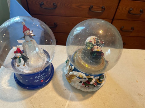 Large assortment of snow globes.