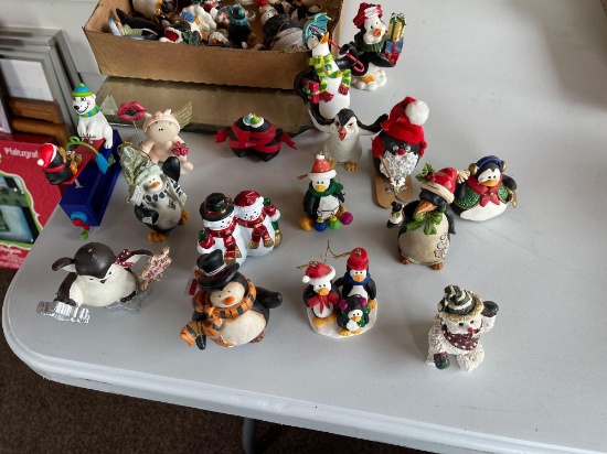 Assortment of penguin figurines.... Shipping