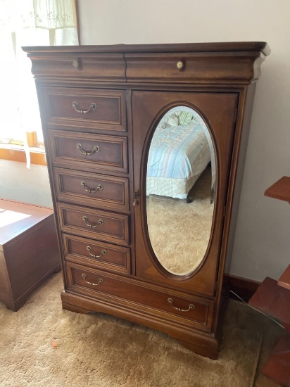 Eight drawer dresser with oblong beveled glass mirror on door 36.5 W, 57.5 H, 19 inches D