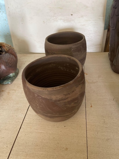 Two large ceramic flower pots.