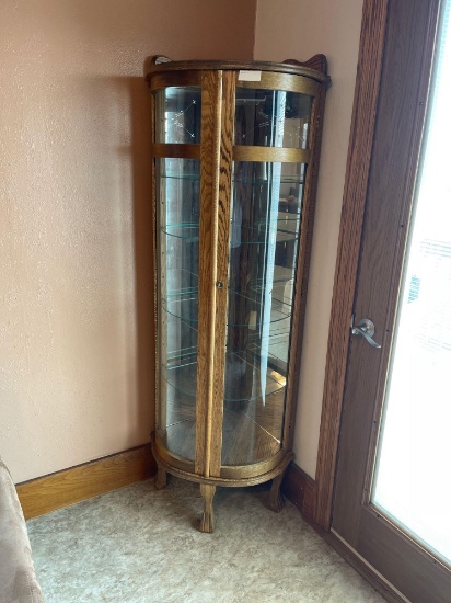 5 foot tall curve glass Curio cabinet with etched glass, five shelves , lighted (nice).