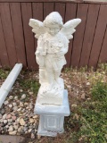 Cement outdoor angel statue with cross