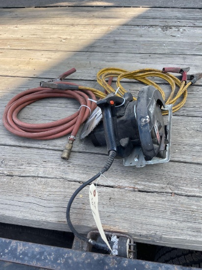 Master Mechanic 7 1/4'' electric saw, jumper cables, air hose.