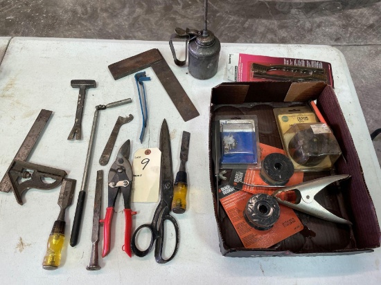 Box of wrenches: tin snips, square, pry bars, oil can, magnet, wood chisels, weed eater automatic