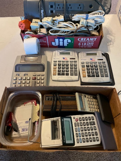 Various calculators, large surge protector, extension cord, and electrical connections