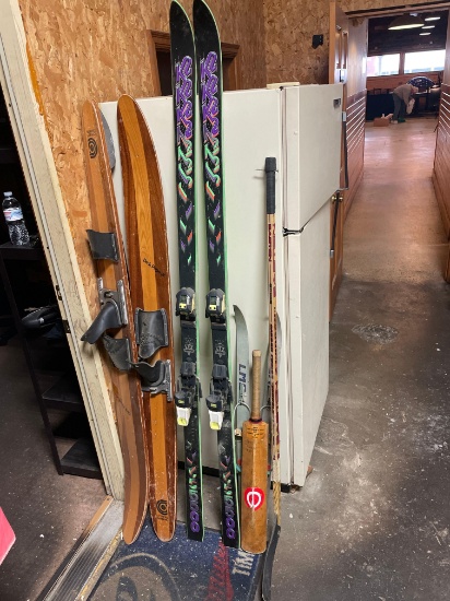 Pair of wood water skies, pair of snow skies, pair of junior snow skies, hockey stick, advertising