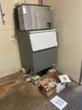 Manitowoc Model B-500PD Ice maker with an automatic cleaning system including supplies and ice