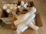 Several hundred 12 oz Coca Cola paper cups, several hundred 12 oz white foam cups, box of lids for