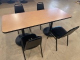 30'' x 72'' double metal pedestal laminate top table with 4 vinyl solid chairs.