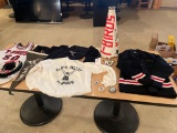 Various sized T-Birds and Floyd Valley shirts and cheerleading memorabilia