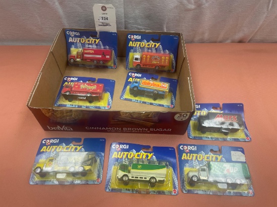 8- Corgi Toys delivery trucks, in original packaging