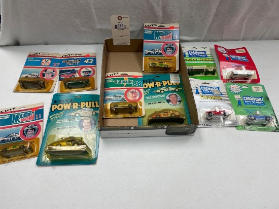 11 Ertl cars, in original package 4- Champion Stores: 3- 1960 Corvette, Tractor Trailer 5- 1/64