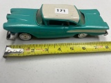 1958 Edsel plastic friction car with metal undercarriage. see picture for undercarriage repair to