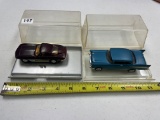 2- cars in display cases