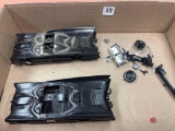 2 batmobile cars with pieces