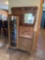Vintage oak ornate side by side secretary with fold down desk and glass display cabinet. This piece