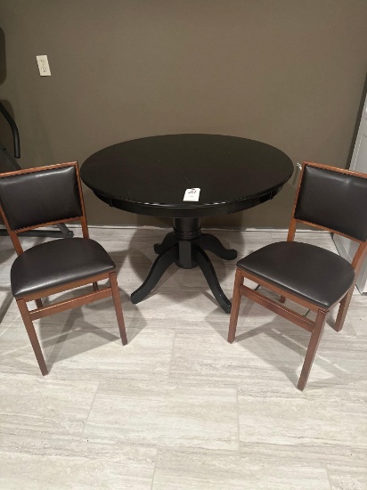 42 inch round, 4 leg, center pedestal table with 2...vinyl/wood folding chairs. A few minor table to