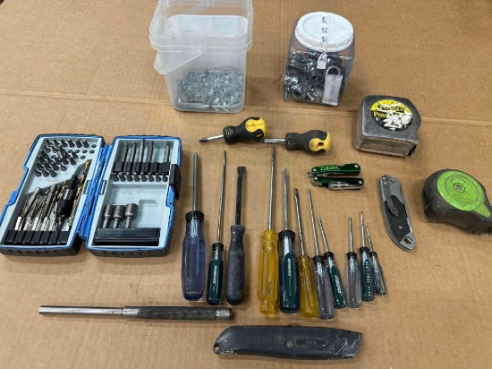 Nut driver kits, measuring tapes, screwdrivers, screws, and electrical connections