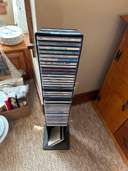 Assortment of CD's with tower.