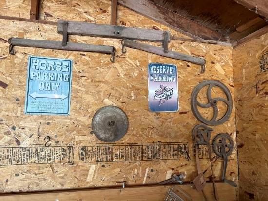 Signs, horse equipment, various wheels, galvanized pail.