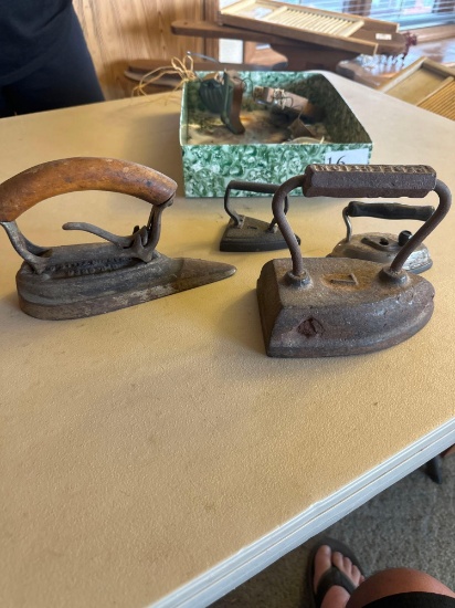 Various kinds and sizes of sad irons.