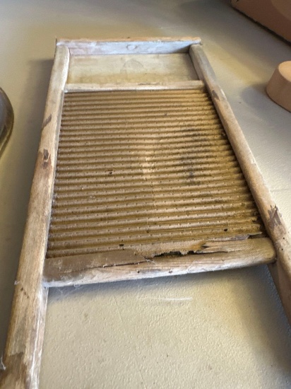 Wash board and various...sizes and kinds of sad irons.