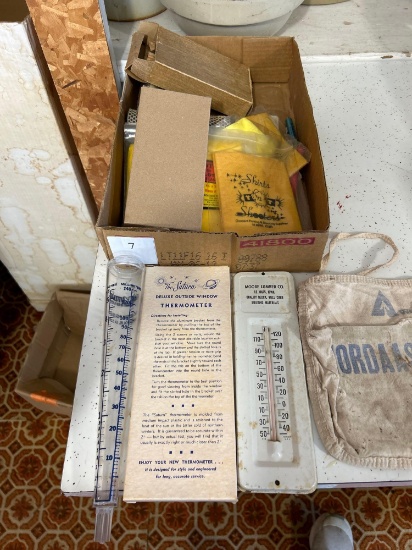 Advertising thermometers and rain gauges, gun wiping cloth, carpenters apron from