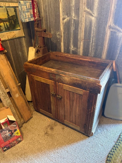 Primitive wooden dry sink with hand water pump attached.... Nice