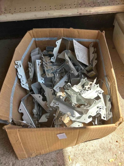 box of metal brackets, decorative sign