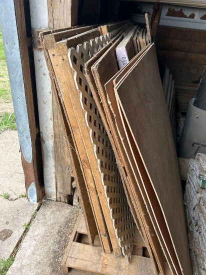 Assorted plywood, insulation, white fencing,