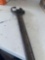 Large crescent wrench.