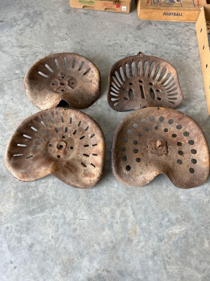 1 cast iron tractor seat and 3 metal seats.