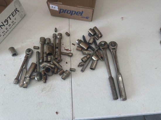 Various sockets and extensions with craftsman ratchets.