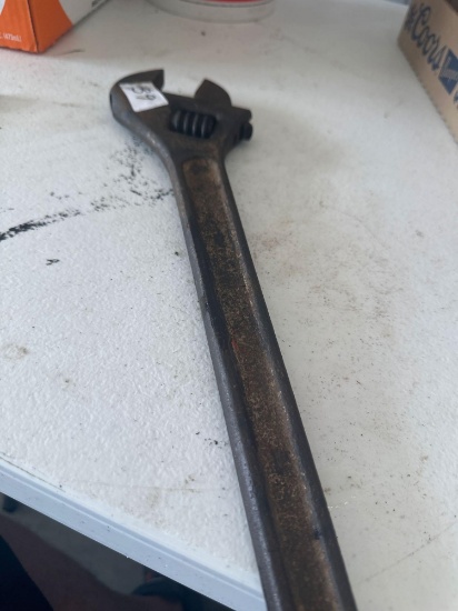Large crescent wrench.