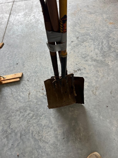 Potato fork and two flat sand shovels.