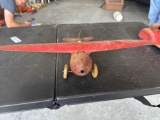 1930's Wyandotte pressed steel toy airplane, wood wheels, 10'' wingspan.