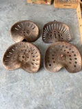 1 cast iron tractor seat and 3 metal seats.