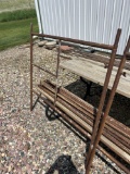 Three pair of scaffolding with braces and one set of casters.