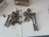 Various sockets and extensions with craftsman ratchets.
