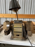 Double wheel bench grinder with shields and light, portable light.