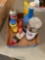 Box of assorted paint, chalk, and aerosol cans