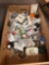 Box of assorted electrical parts, electrical tape, wire nuts, electrical switches, outlets