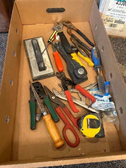 Box of assorted tools, tape measure, crescent wrench, pliers