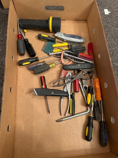 Box of assorted screw drivers, pliers, utility knives, flashlight
