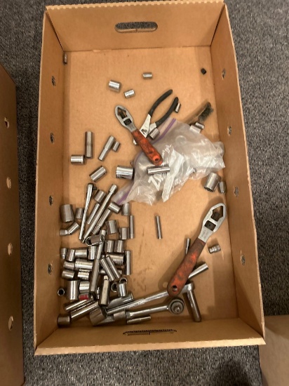 Box of assorted sockets and tools
