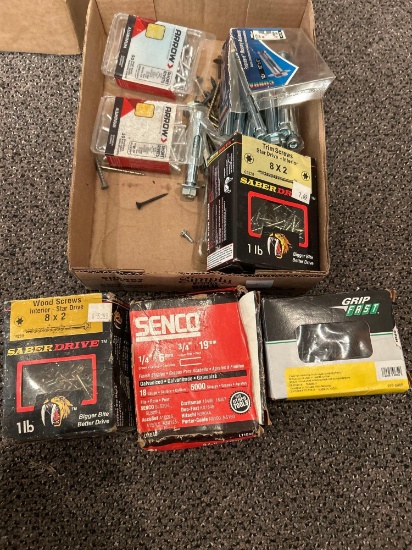 Box of assorted screws, fasteners, and nails