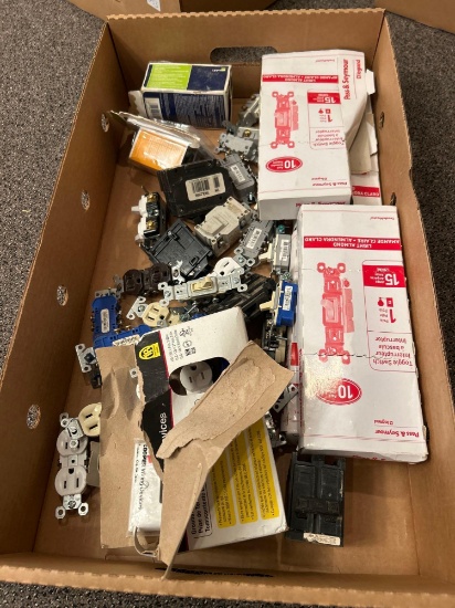 Box of assorted light switches and outlets most NIB